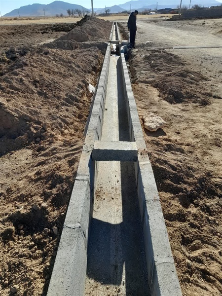 جدول گذاری وآماده سازی معابر روستای توزلو برای آسفالت ریزی